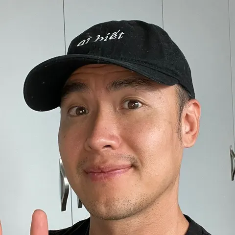 Chris Tran wearing a dark cap