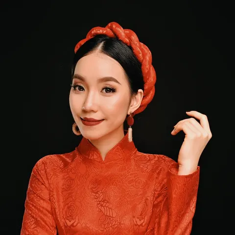 Ms. Yummyface wearing a red outfit and headband